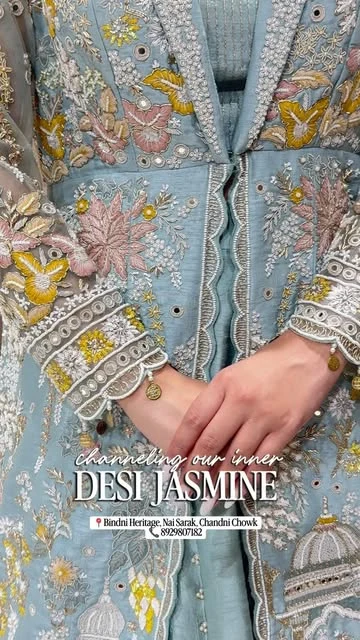 Blue embroidered Indian outfit with floral and mirror details