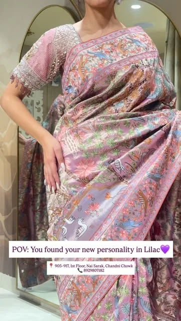 Lilac saree with colourful detailed motifs